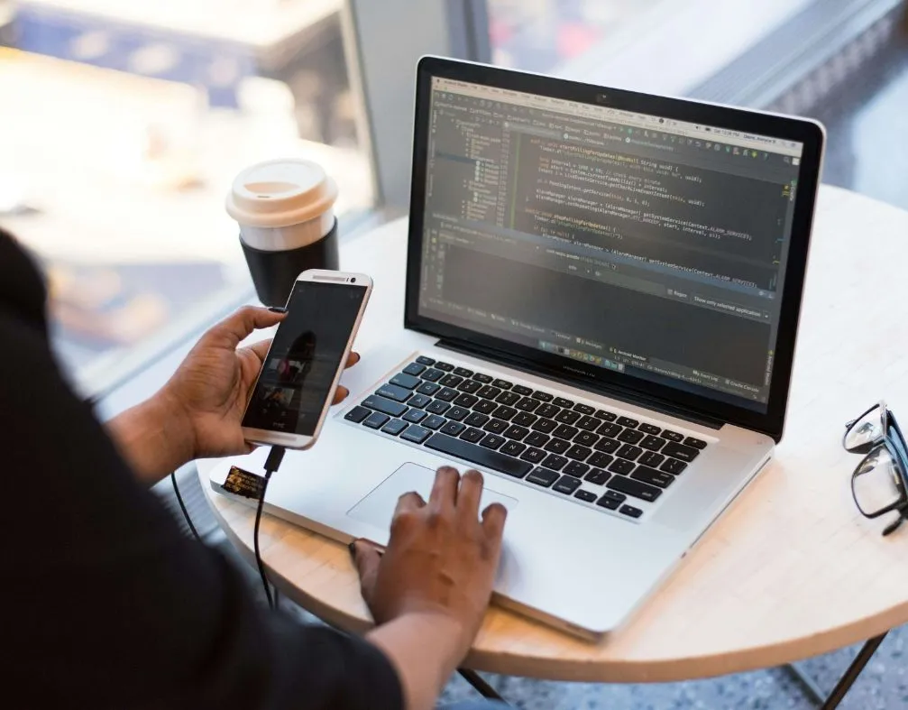 developers working on a software and on the phone