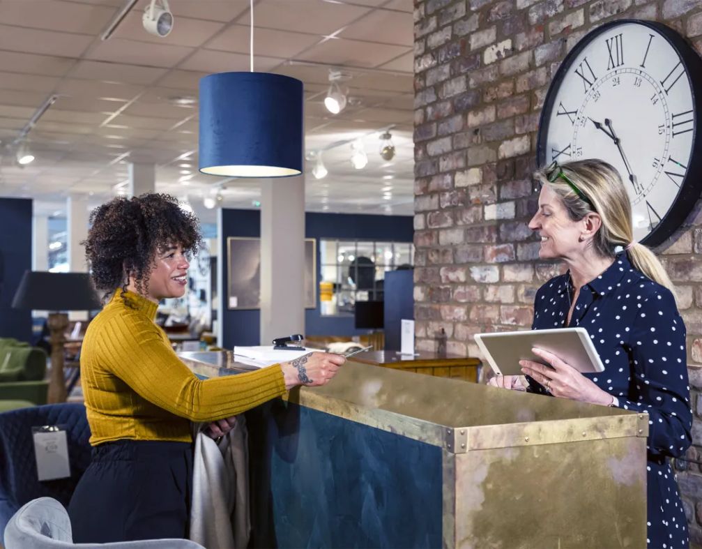 customer paying for furniture at a furniture store